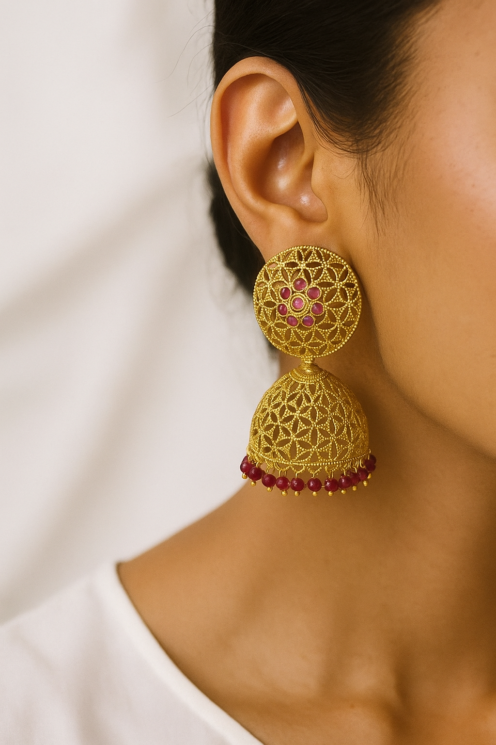 Traditional Gold Finish Jhumka Earrings with Ruby Beads